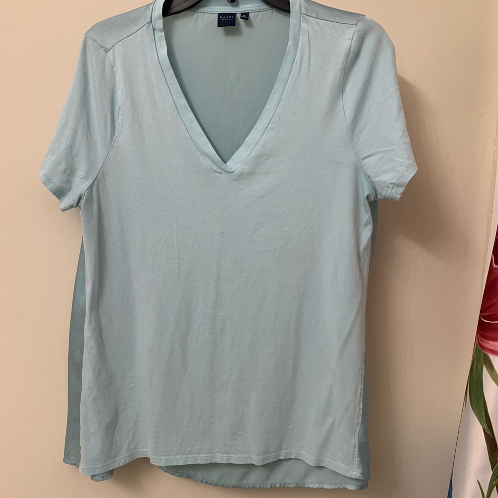 Dual material light teal v-neck top.
